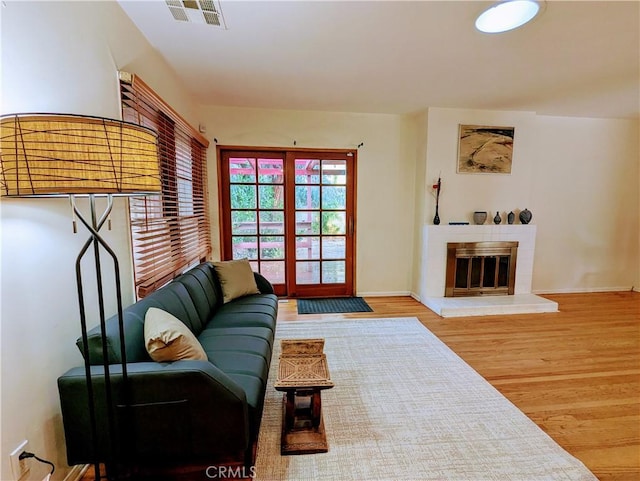 15123 Killion St, Sherman Oaks, CA 91411 - living area featuring wood finished floors, a fireplace, and baseboards