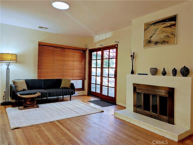 15123 Killion St, Sherman Oaks, CA 91411 - living room with a brick fireplace, wood finished floors, and baseboards