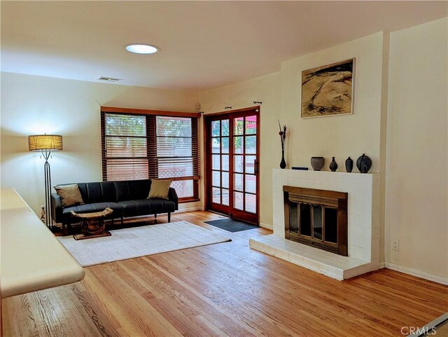 15123 Killion St, Sherman Oaks, CA 91411 - living room with wood finished floors, healthy amount of natural light, a brick fireplace, recessed lighting, and baseboards