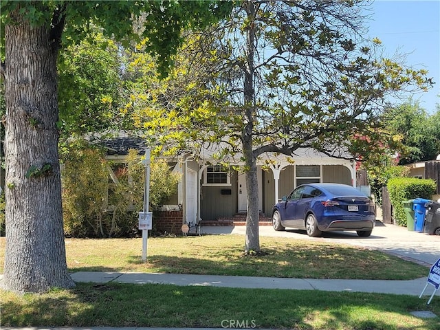15123 Killion St, Sherman Oaks, CA 91411 - obstructed view of property featuring a front yard and concrete driveway
