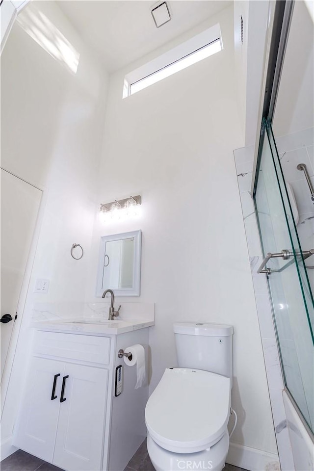 5441 Twin Lakes Dr, Cypress, CA 90630 - full bathroom featuring vanity, toilet, a high ceiling, and enclosed tub / shower combo