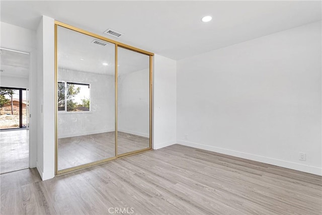 14855 Flathead Rd, Apple Valley, CA 92307 - unfurnished bedroom featuring wood finished floors, a closet, baseboards, and recessed lighting