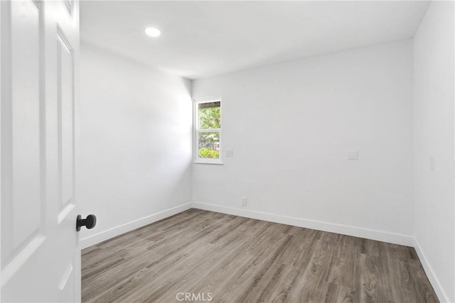 14855 Flathead Rd, Apple Valley, CA 92307 - unfurnished room with wood finished floors, baseboards, and recessed lighting