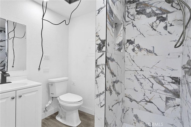 14855 Flathead Rd, Apple Valley, CA 92307 - bathroom with vanity, toilet, a marble finish shower, and wood finished floors
