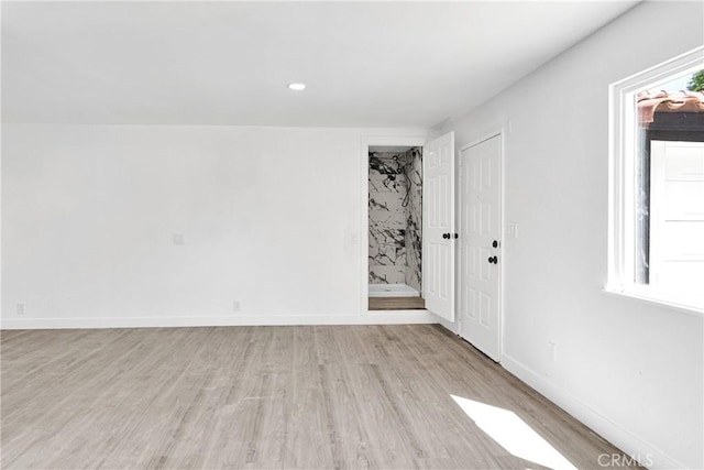 14855 Flathead Rd, Apple Valley, CA 92307 - spare room featuring light wood-style flooring, baseboards, and recessed lighting