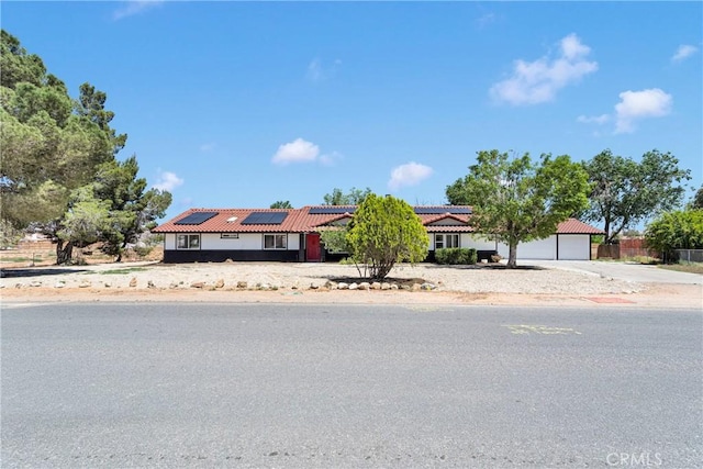14855 Flathead Rd, Apple Valley, CA 92307 - view of front of property featuring a tiled roof, solar panels, and concrete driveway