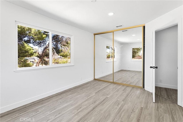 14855 Flathead Rd, Apple Valley, CA 92307 - unfurnished bedroom featuring light wood finished floors, baseboards, a closet, and recessed lighting