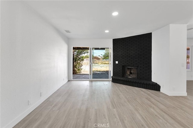 14855 Flathead Rd, Apple Valley, CA 92307 - unfurnished living room featuring baseboards, wood finished floors, recessed lighting, and a fireplace