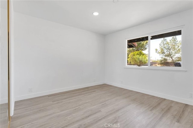 14855 Flathead Rd, Apple Valley, CA 92307 - unfurnished room with light wood finished floors, recessed lighting, and baseboards