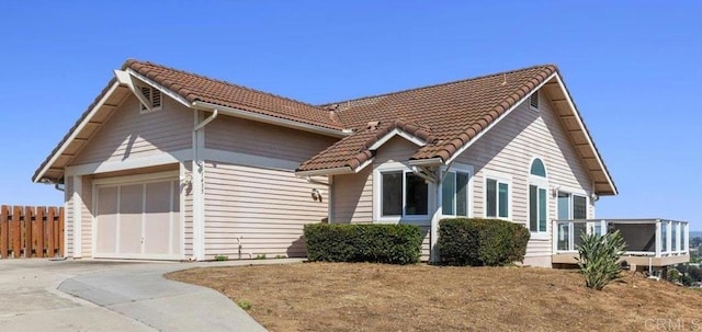 1435 Archwood Pl, Escondido, CA 92026 - view of front of house featuring a tile roof, driveway, and a garage