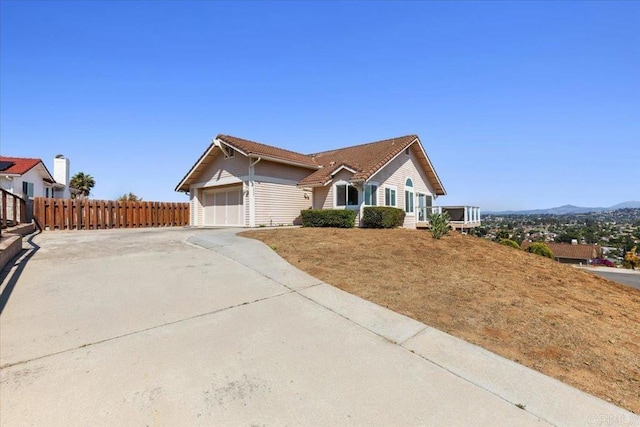 1435 Archwood Pl, Escondido, CA 92026 - single story home featuring a garage, driveway, and a mountain view