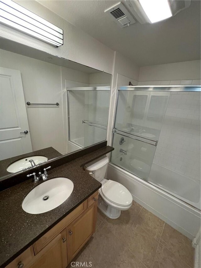78 E Bay State St Unit 1E, Alhambra, CA 91801 - bathroom with shower / bath combination with glass door, toilet, vanity, and tile patterned flooring