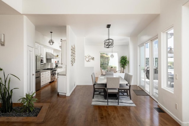 7784 Lookout Dr, La Jolla, CA 92037 - dining room with dark wood-style floors and baseboards