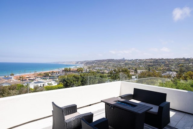 7784 Lookout Dr, La Jolla, CA 92037 - view of patio / terrace with an outdoor fire pit, a balcony, and a water view