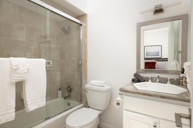 7784 Lookout Dr, La Jolla, CA 92037 - full bathroom featuring vanity, combined bath / shower with glass door, toilet, ensuite bathroom, and baseboards