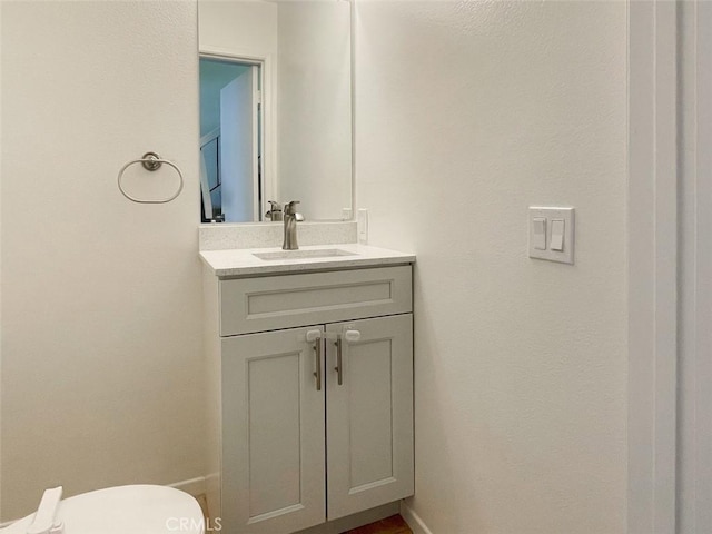 17081 Green Ln, Huntington Beach, CA 92649 - half bathroom featuring vanity and toilet