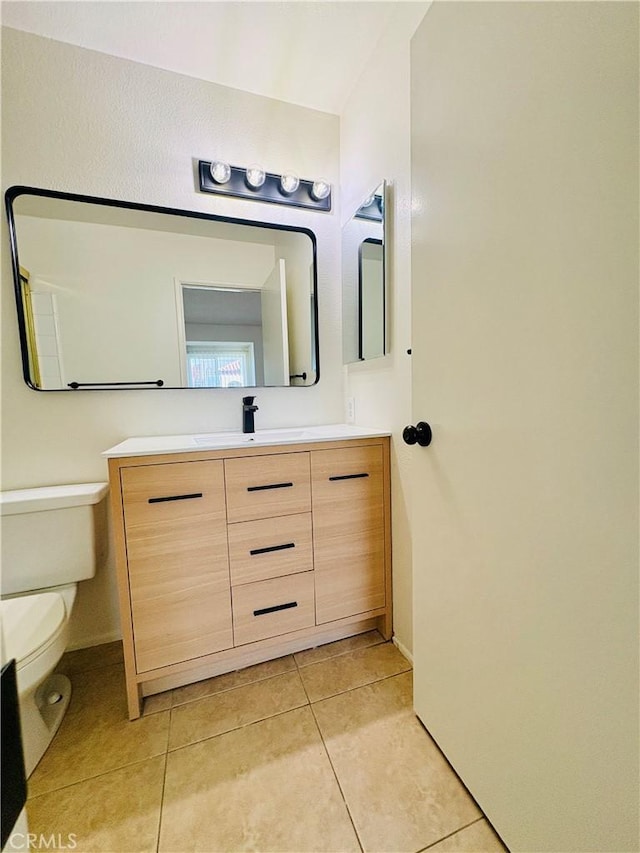 17081 Green Ln, Huntington Beach, CA 92649 - bathroom with tile patterned flooring, vanity, and toilet
