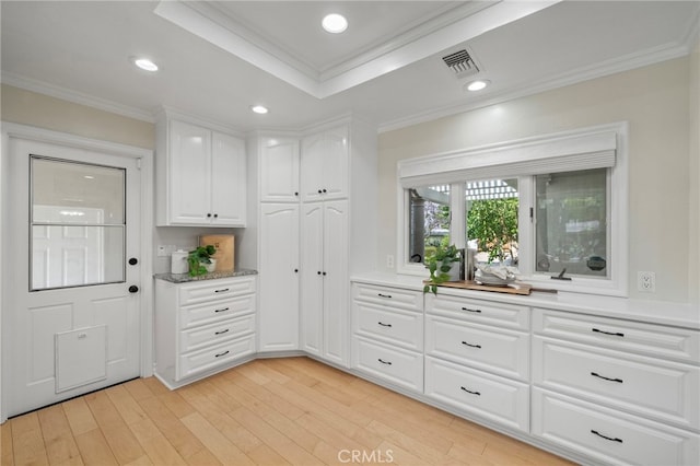 13782 Gershon Pl, North Tustin, CA 92705 - kitchen with ornamental molding, white cabinets, light wood finished floors, a raised ceiling, and recessed lighting