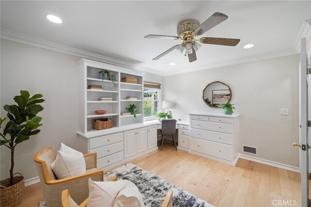 13782 Gershon Pl, North Tustin, CA 92705 - living area with ceiling fan, light wood finished floors, ornamental molding, recessed lighting, and built in desk