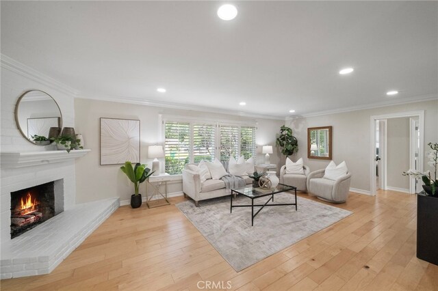 13782 Gershon Pl, North Tustin, CA 92705 - living area featuring a fireplace, recessed lighting, light wood finished floors, and ornamental molding
