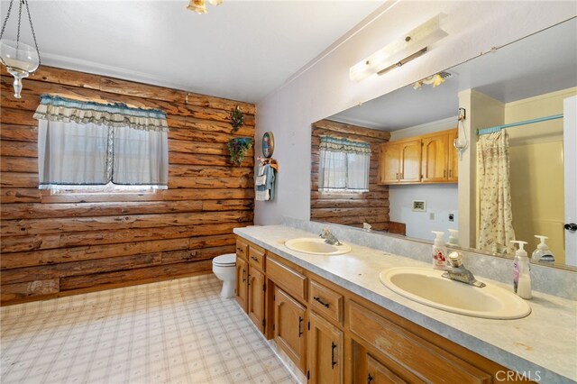38579 Payne Way, Caliente, CA 93518 - bathroom featuring log walls, double vanity, toilet, and a shower with shower curtain