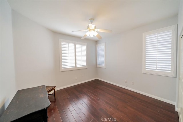 543 Northwood Ave, Banning, CA 92220 - unfurnished room featuring a ceiling fan, dark wood-type flooring, and baseboards