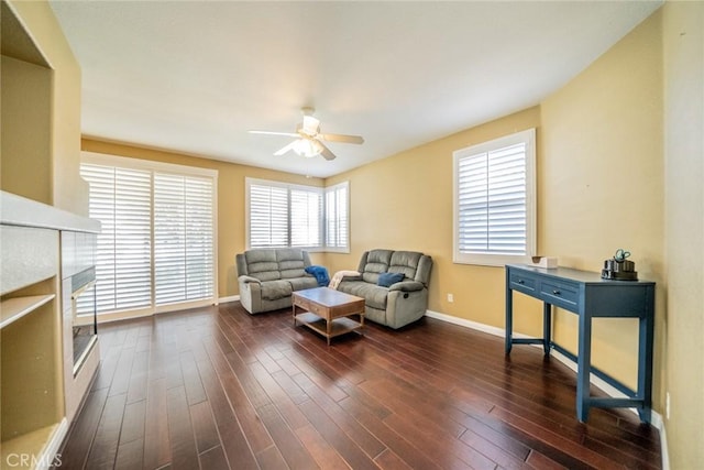 543 Northwood Ave, Banning, CA 92220 - living area with a ceiling fan and dark wood-style flooring