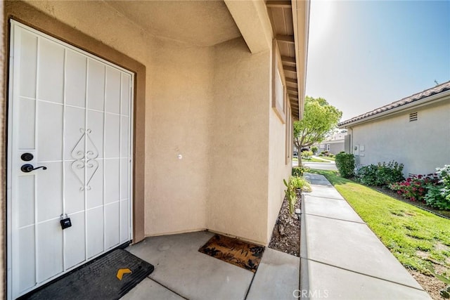 543 Northwood Ave, Banning, CA 92220 - entrance to property featuring stucco siding