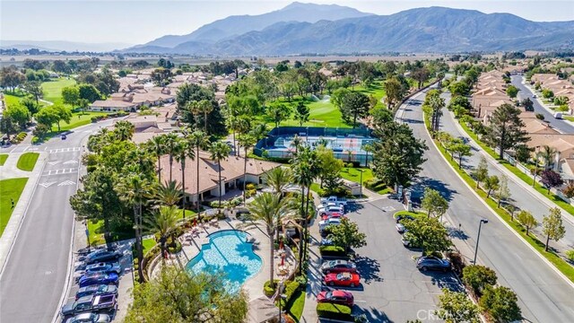 543 Northwood Ave, Banning, CA 92220 - aerial perspective of suburban area featuring a mountainous background and a pool area