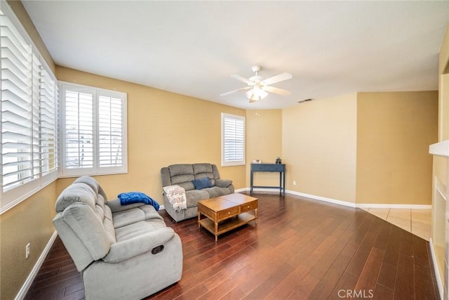 543 Northwood Ave, Banning, CA 92220 - living area featuring ceiling fan, wood finished floors, and baseboards