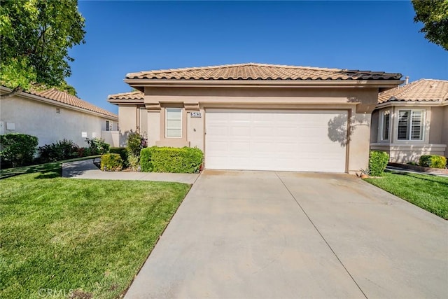 543 Northwood Ave, Banning, CA 92220 - mediterranean / spanish house with a tile roof, driveway, a garage, and stucco siding