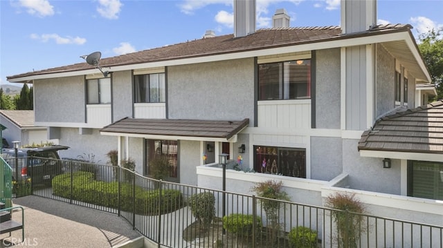 2346 Royal Ave Unit 9, Simi Valley, CA 93065 - view of front of home with a chimney and stucco siding