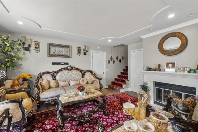 2346 Royal Ave Unit 9, Simi Valley, CA 93065 - living area with recessed lighting, wood finished floors, a glass covered fireplace, and ornamental molding