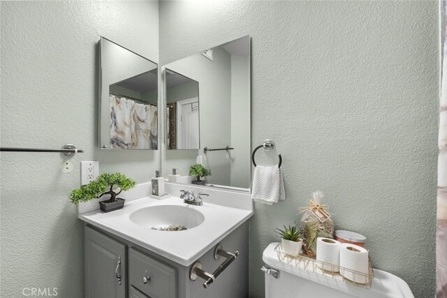 2346 Royal Ave Unit 9, Simi Valley, CA 93065 - full bathroom with toilet, vanity, and a textured wall