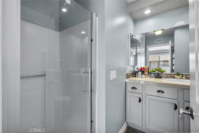 2346 Royal Ave Unit 9, Simi Valley, CA 93065 - full bath featuring a textured wall, a shower stall, vanity, baseboards, and toilet