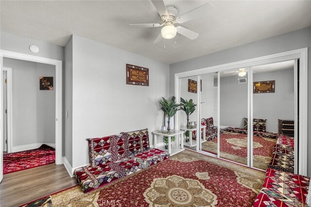 2346 Royal Ave Unit 9, Simi Valley, CA 93065 - living area with ceiling fan, wood finished floors, and baseboards