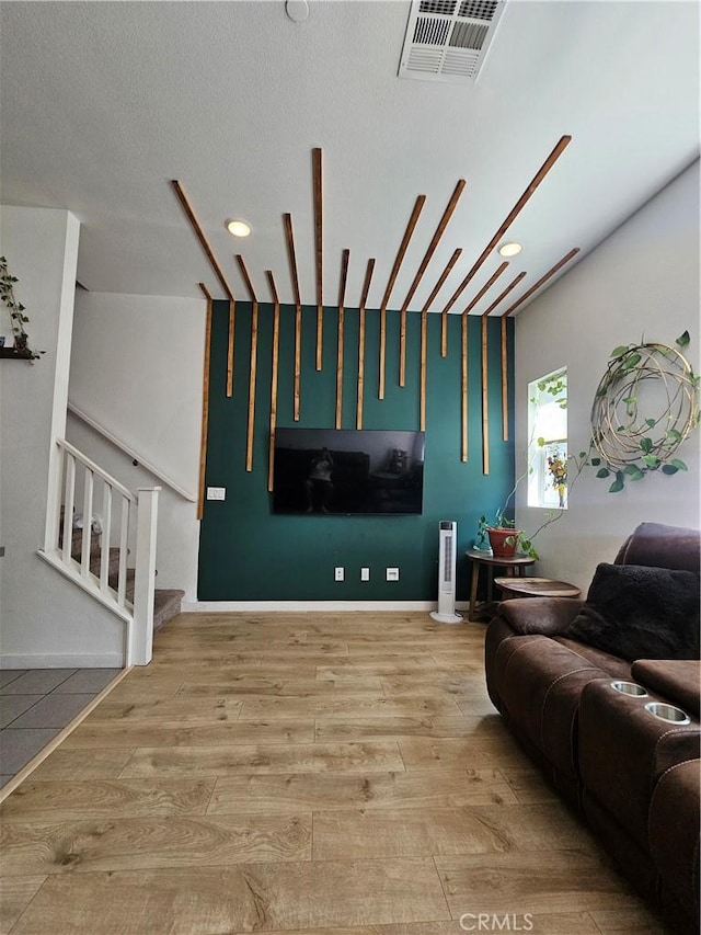 10402 Harlow Cir Unit 41, San Diego, CA 92108 - living room with wood finished floors, stairs, and recessed lighting