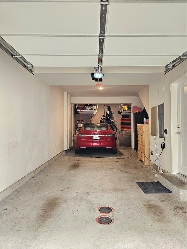 10402 Harlow Cir Unit 41, San Diego, CA 92108 - garage with electric panel and a garage door opener