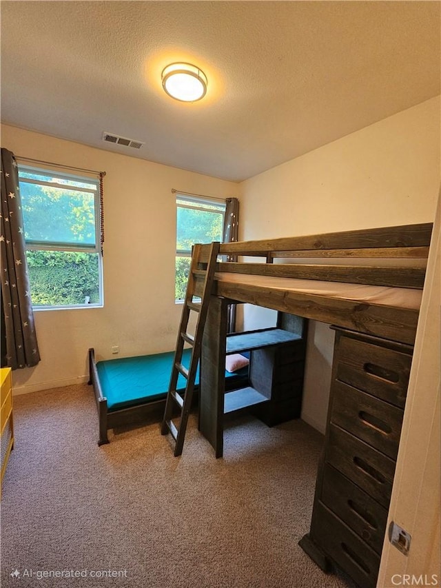 10402 Harlow Cir Unit 41, San Diego, CA 92108 - carpeted bedroom featuring a textured ceiling
