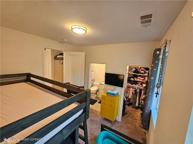 10402 Harlow Cir Unit 41, San Diego, CA 92108 - carpeted bedroom featuring a walk in closet, a closet, and connected bathroom