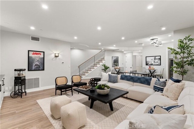 2141 Circle Dr, Hermosa Beach, CA 90254 - living room featuring recessed lighting, stairs, light wood-type flooring, and baseboards