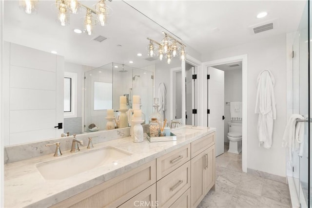 2141 Circle Dr, Hermosa Beach, CA 90254 - bathroom featuring a stall shower, double vanity, toilet, a chandelier, and recessed lighting