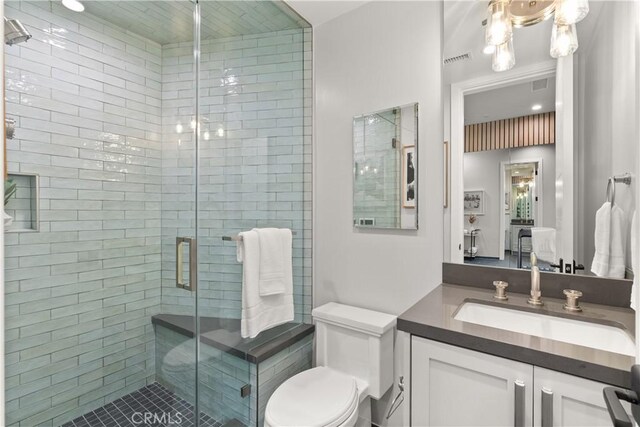 2141 Circle Dr, Hermosa Beach, CA 90254 - full bathroom with vanity, a stall shower, toilet, and tile patterned flooring