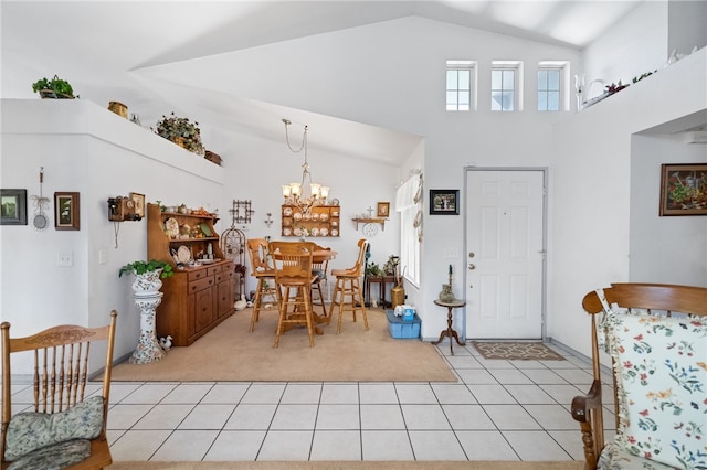 32725 Trailwood Ct, Wildomar, CA 92595 - entrance foyer featuring light carpet, light tile patterned floors, high vaulted ceiling, and a chandelier