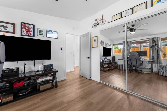 6252 Lake Albano Ave, San Diego, CA 92119 - living area with a ceiling fan, a desk, wood finished floors, and baseboards