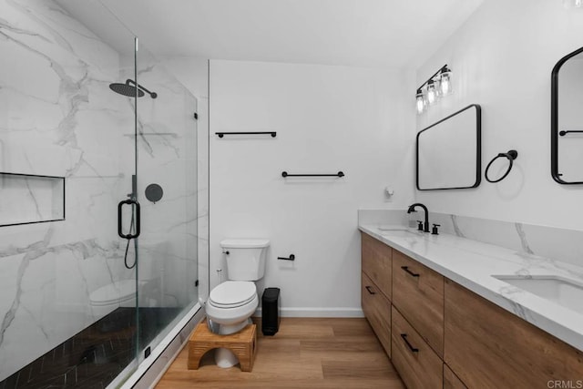 6252 Lake Albano Ave, San Diego, CA 92119 - bathroom featuring toilet, wood finished floors, a marble finish shower, double vanity, and baseboards