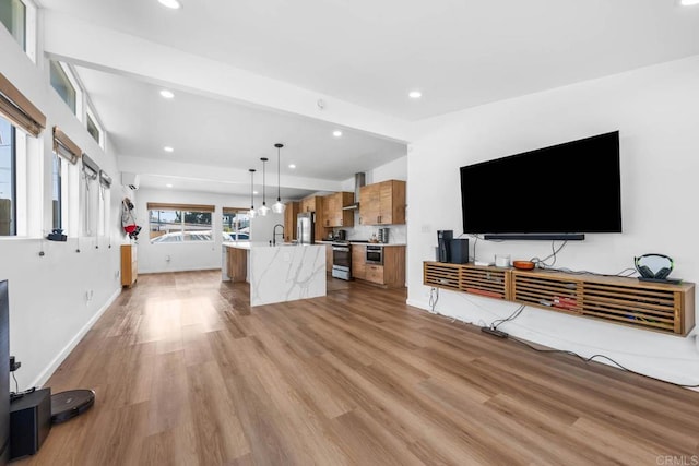 6252 Lake Albano Ave, San Diego, CA 92119 - unfurnished living room with recessed lighting, light wood-style flooring, a sink, and baseboards