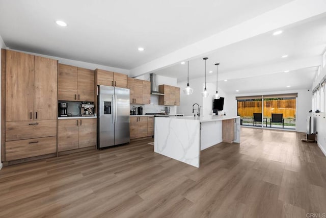 6252 Lake Albano Ave, San Diego, CA 92119 - kitchen with stainless steel fridge, wall chimney range hood, open floor plan, beam ceiling, and wood finished floors