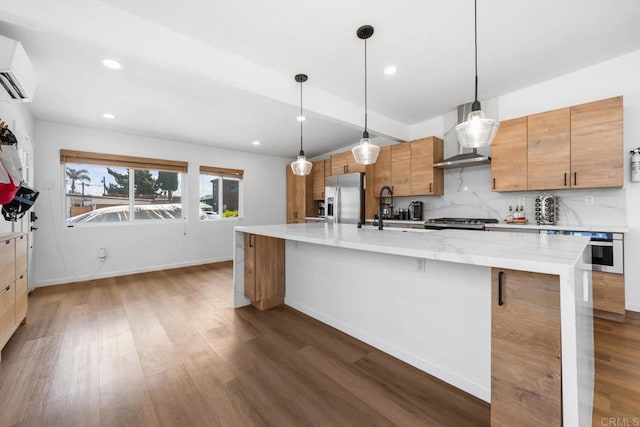 6252 Lake Albano Ave, San Diego, CA 92119 - kitchen featuring stainless steel appliances, wall chimney range hood, a sink, wood finished floors, and recessed lighting