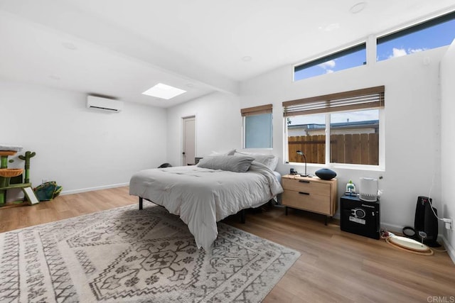 6252 Lake Albano Ave, San Diego, CA 92119 - bedroom featuring a wall mounted air conditioner and wood finished floors